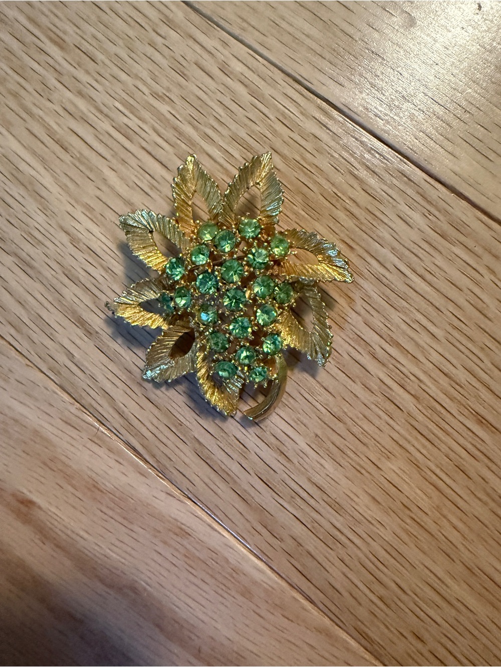 Vintage Uranium Gold-Tone Leaf Brooch with Green Crystal Accents